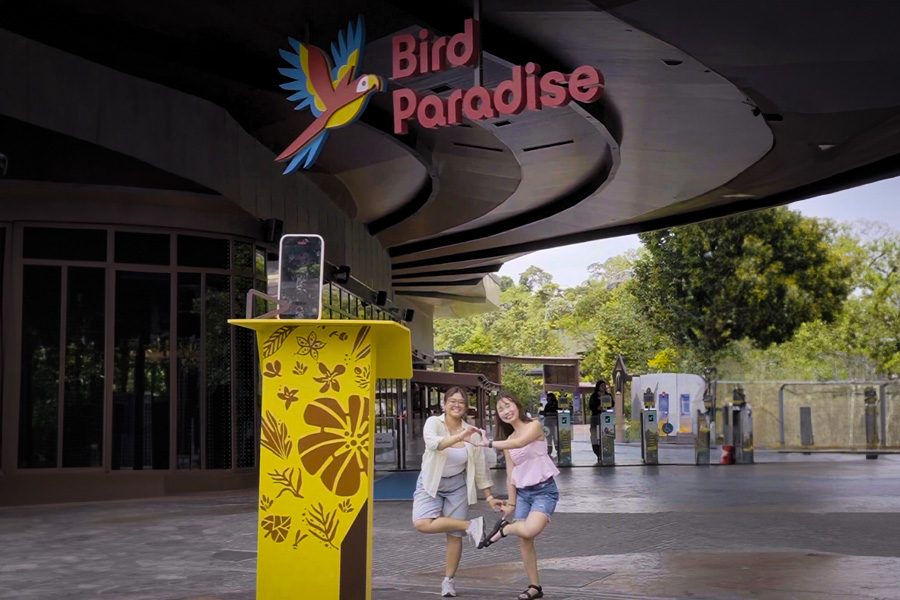 Image of two girls using the Selfie Station to take selfies